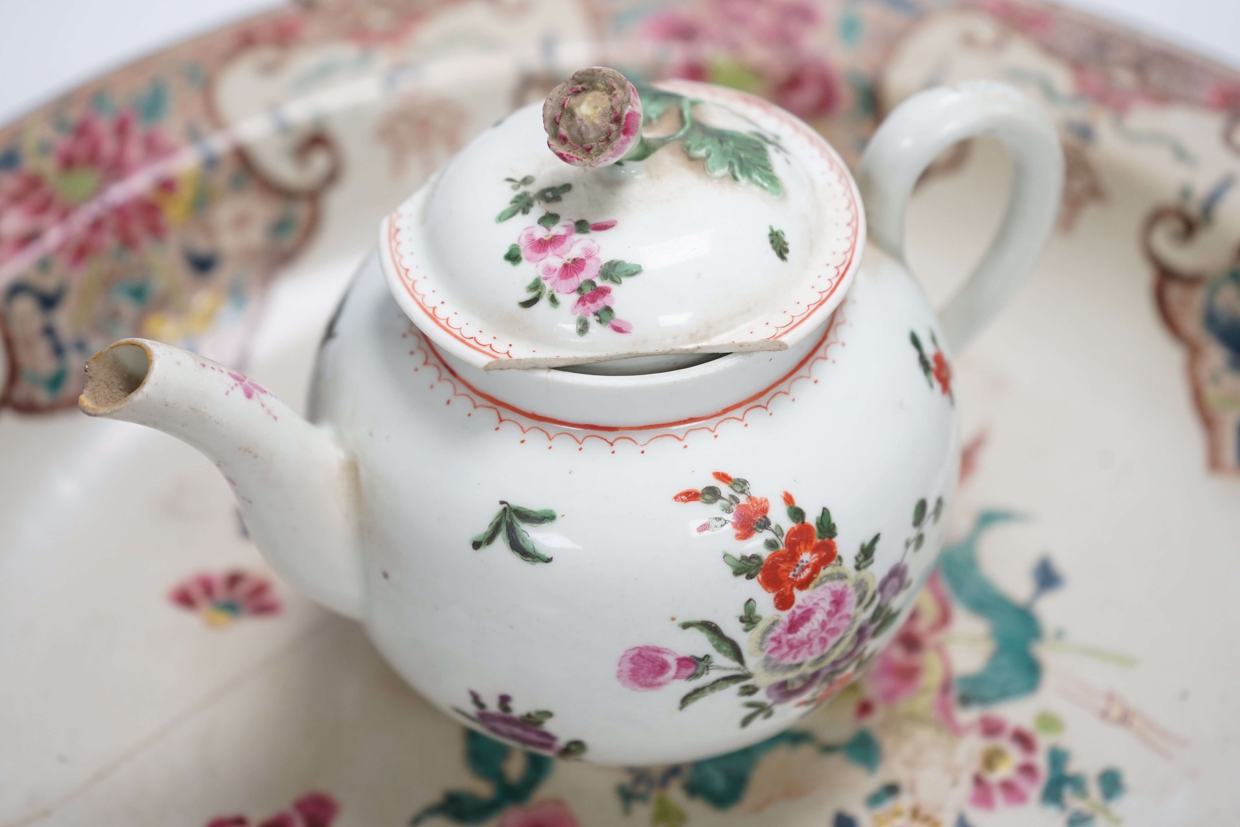 A Worcester teapot, c.1770, two 18th century Chinese porcelain dishes, a cup and saucer, a Chinese shallow bowl and a small teapot, largest dish 39cm